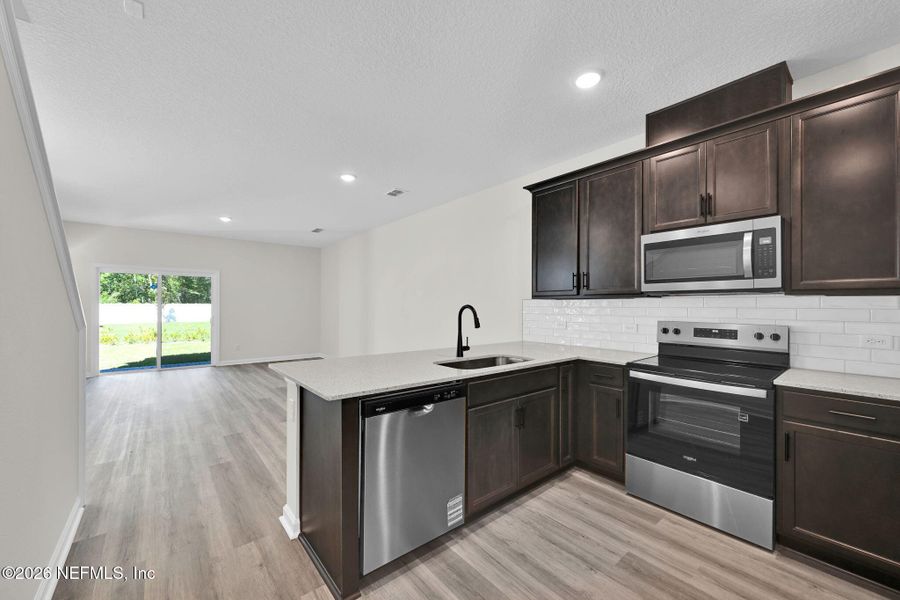 Furnished interior view inside a new home in Baxley Villas, Middleburg (Image 9).