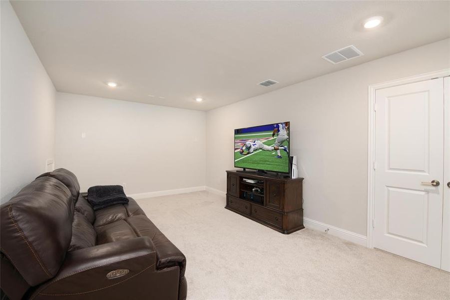 Selected as a builder upgrade, this private media room is tucked behind French doors just off the game room, creating the perfect space to enjoy movies and entertainment without disturbing the rest of the home. Selected as a builder upgrade, this private media room is tucked behind French doors just off the game room, creating the perfect space to enjoy movies and entertainment without disturbing the rest of the home.