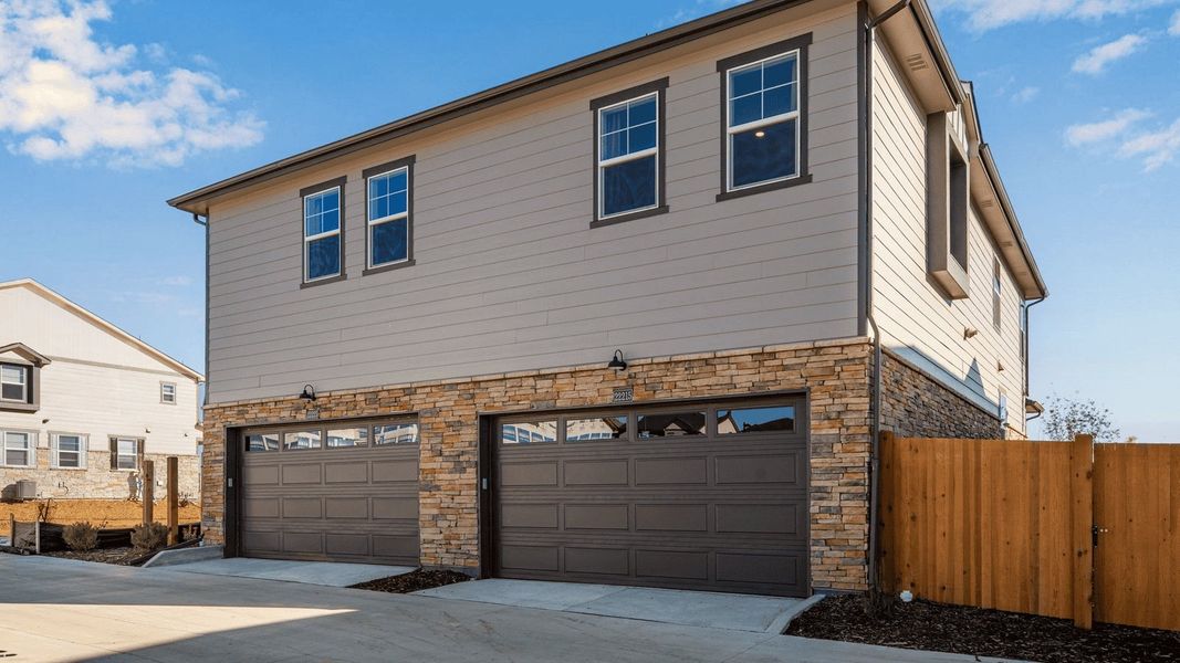 Front exterior of a new home in Horizon Uptown, Aurora, CO, highlighting curb appeal (Image 1). Front exterior of a new home in Horizon Uptown, Aurora, CO, highlighting curb appeal (Image 1).