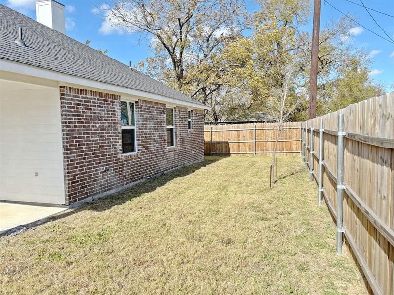 View of fenced backyard