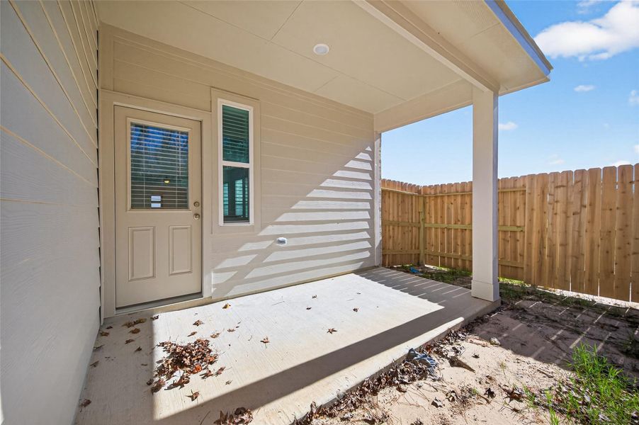 Exterior details and patio area of a home in Enclave at Willis, Willis (Image 3).