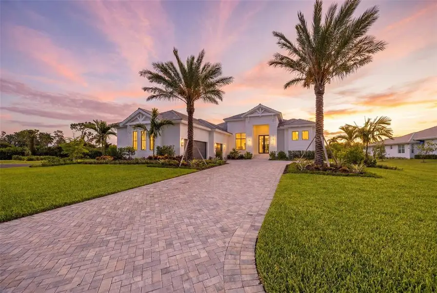 Front exterior of a new home in , Fort Myers, FL, highlighting curb appeal (Image 1). Front exterior of a new home in , Fort Myers, FL, highlighting curb appeal (Image 1).