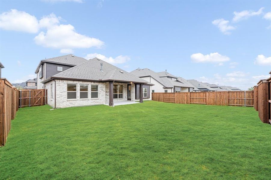 Exterior details and patio area of a home in Windsong Ranch Classic 61, Prosper (Image 27).