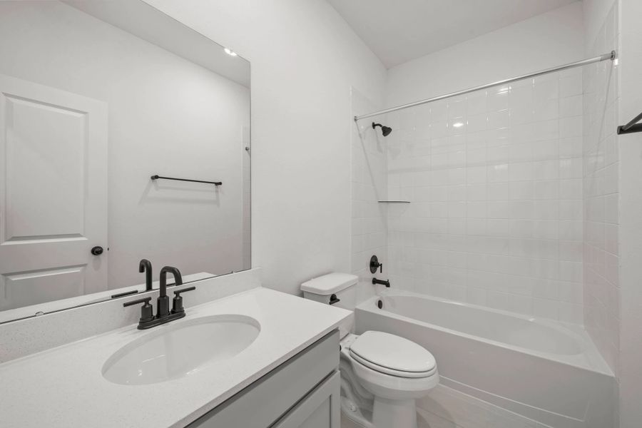 Secondary bathroom. Sample product photo. Actual exterior and interior selections may vary by homesite. Photo may be virtually staged.
