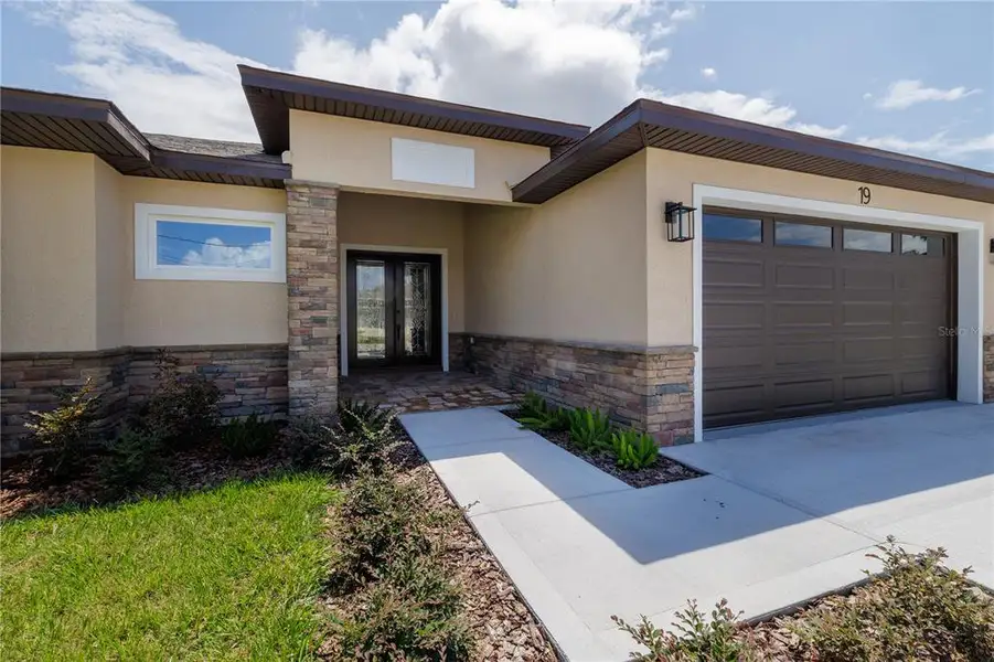 Exterior details and patio area of a home in , Palm Coast (Image 4). Exterior details and patio area of a home in , Palm Coast (Image 4).