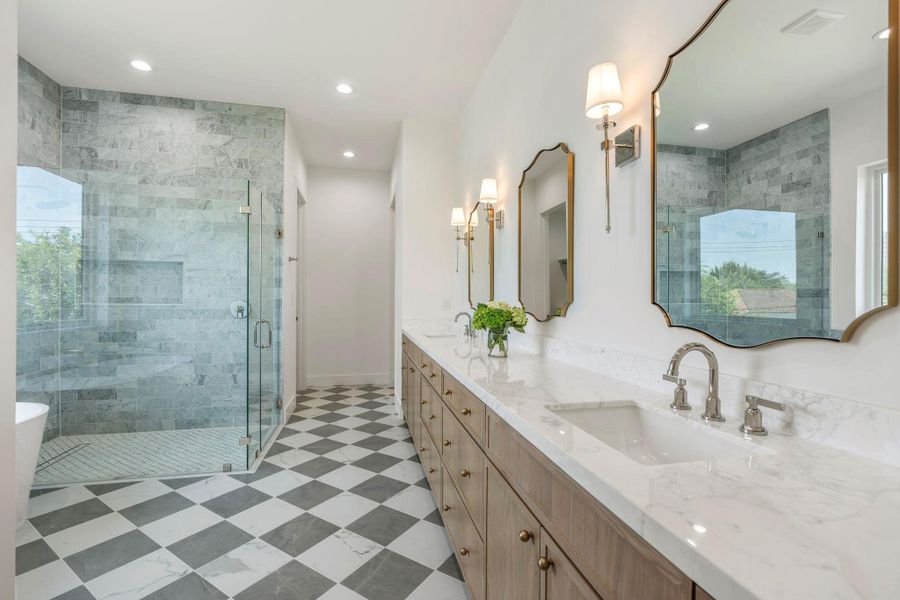 Expansive dual-sink vanity providing ample storage.