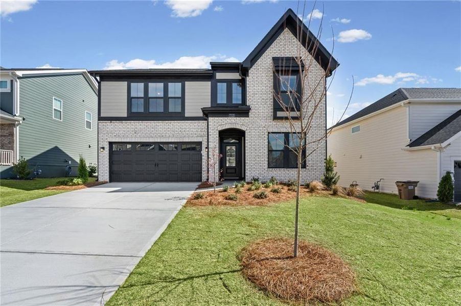 Front exterior of a new home in Twin Lakes, Hoschton, GA, highlighting curb appeal (Image 2). Front exterior of a new home in Twin Lakes, Hoschton, GA, highlighting curb appeal (Image 2).