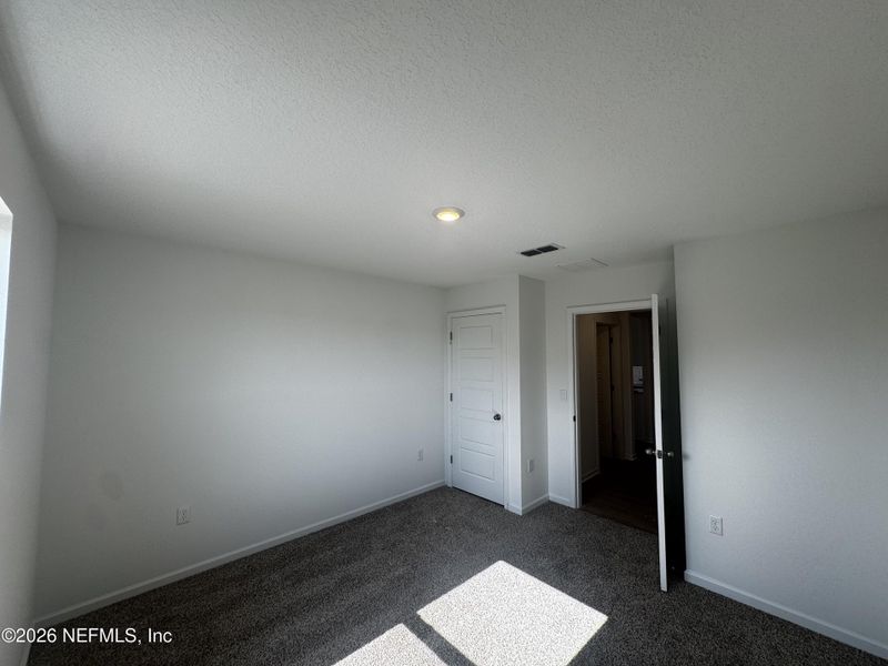Spacious, unfurnished interior of a new home in The Arbors, Jacksonville (Image 26).