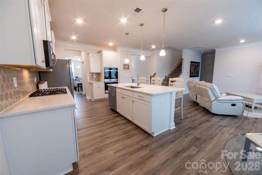 Kitchen with large island offering additional seating.