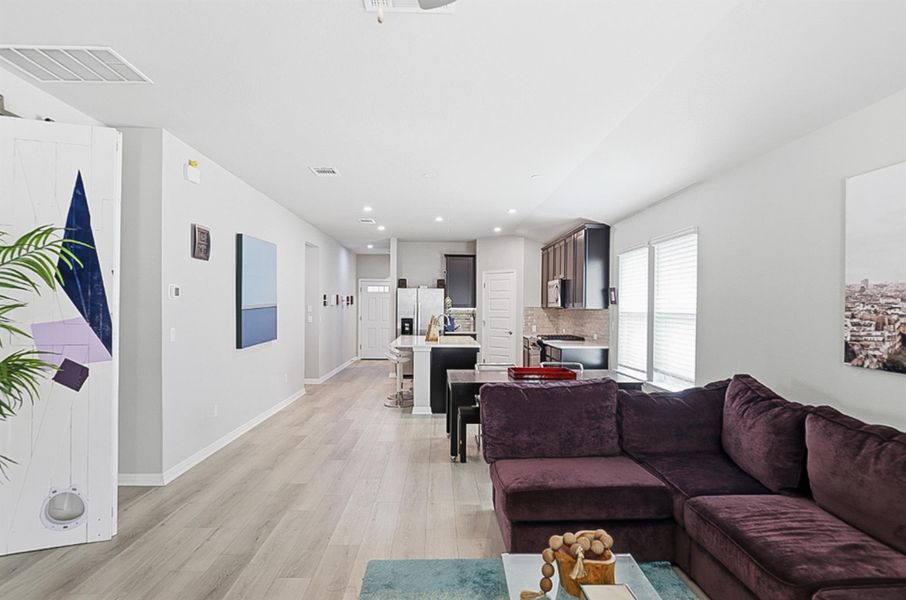 Beautiful, low-maintenance LVP flooring flows through the common areas.