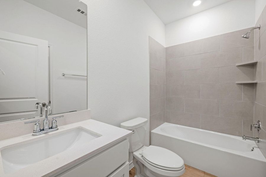 Full bathroom with shower / tub combination and vanity