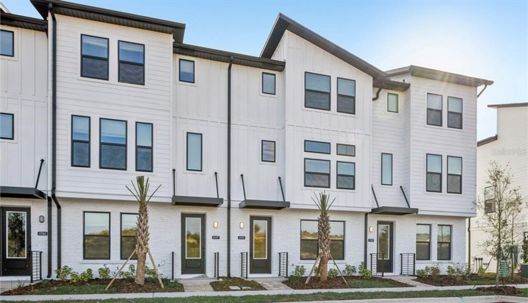 Front exterior of a new home in Parkview at Hamlin, Winter Garden, FL, highlighting curb appeal (Image 1). Front exterior of a new home in Parkview at Hamlin, Winter Garden, FL, highlighting curb appeal (Image 1).