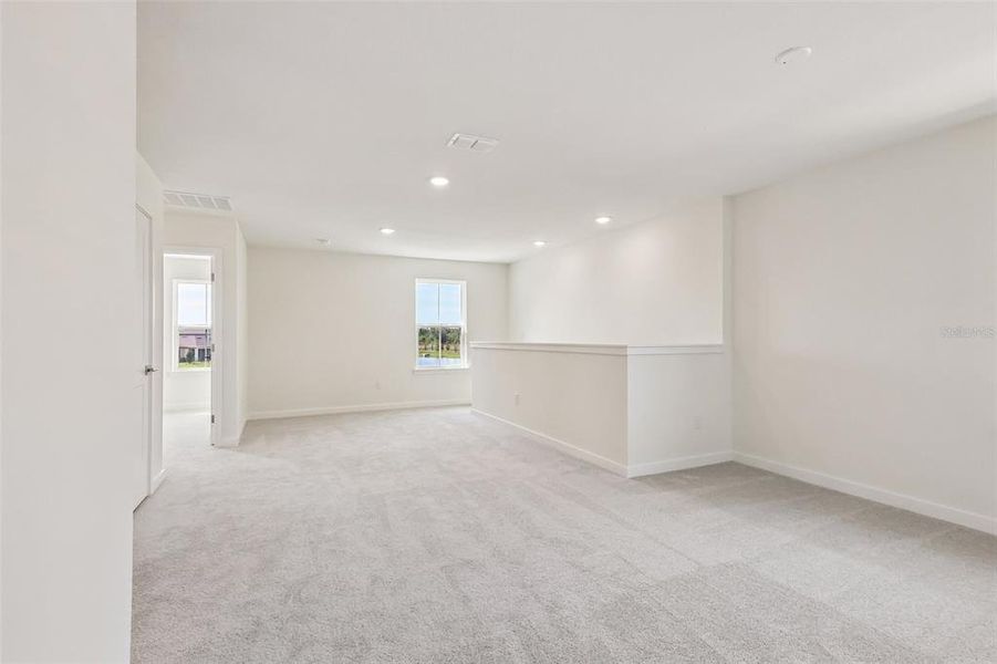 Spacious, unfurnished interior of a new home in Grasslands West, Lakeland (Image 30).