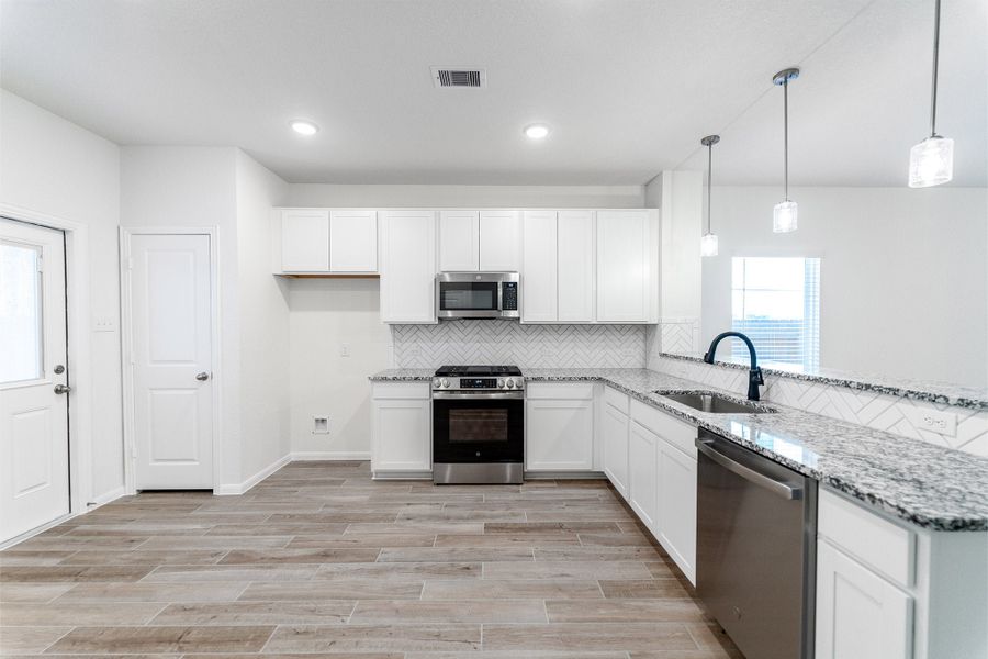 Furnished interior view inside a new home in Cielo, Conroe (Image 6).