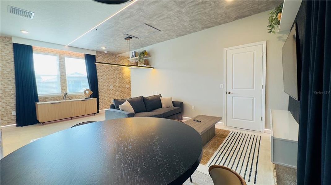 Furnished interior view inside a new home in Harvest at Ovation, Winter Garden (Image 47).