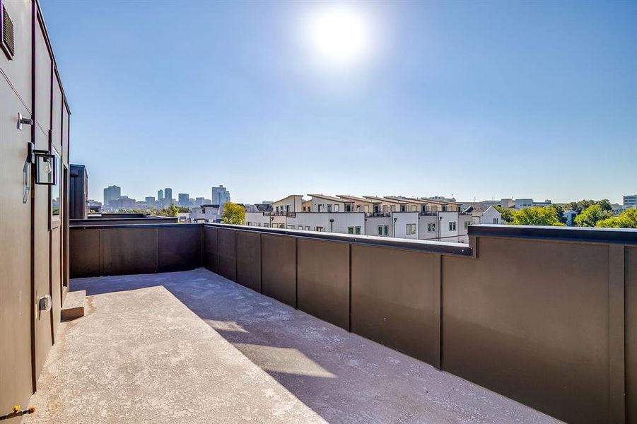 Spacious rooftop deck perfect for entertaining or relaxing under the city lights. Spacious rooftop deck perfect for entertaining or relaxing under the city lights.