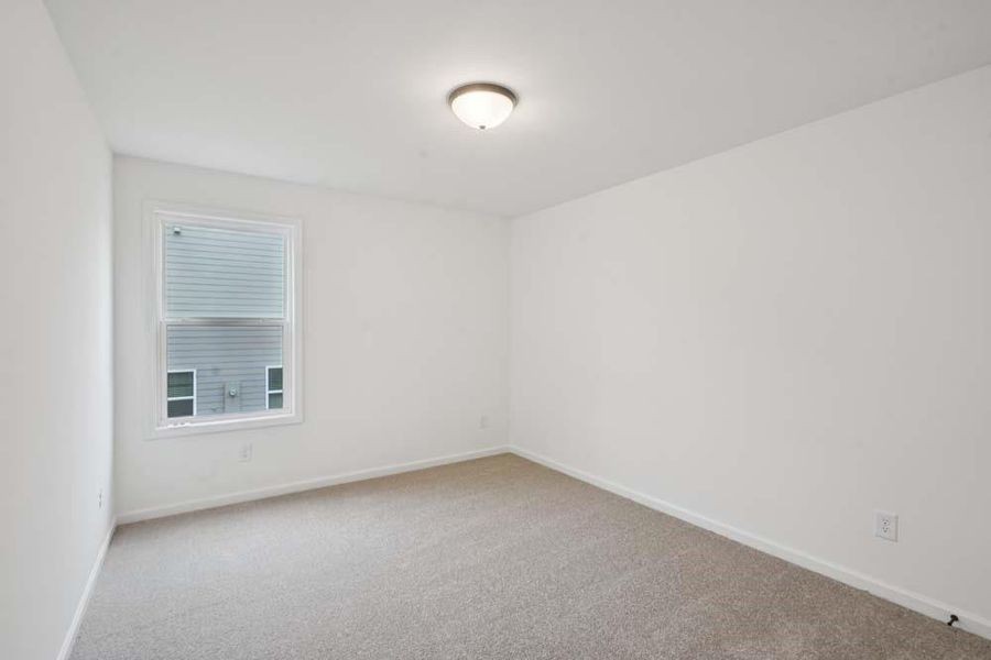 Spacious, unfurnished interior of a new home in Eastlyn Crossing, Flowery Branch (Image 18).