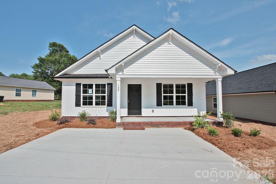 Front exterior of a new home in , Landis, NC, highlighting curb appeal (Image 15).
