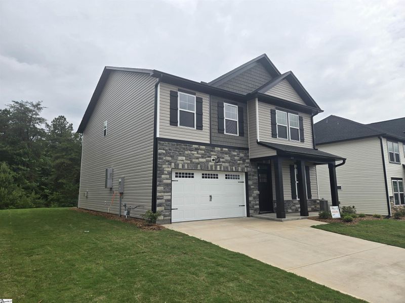 Front exterior of a new home in Shiloh Trail, Wellford, SC, highlighting curb appeal (Image 2). Front exterior of a new home in Shiloh Trail, Wellford, SC, highlighting curb appeal (Image 2).