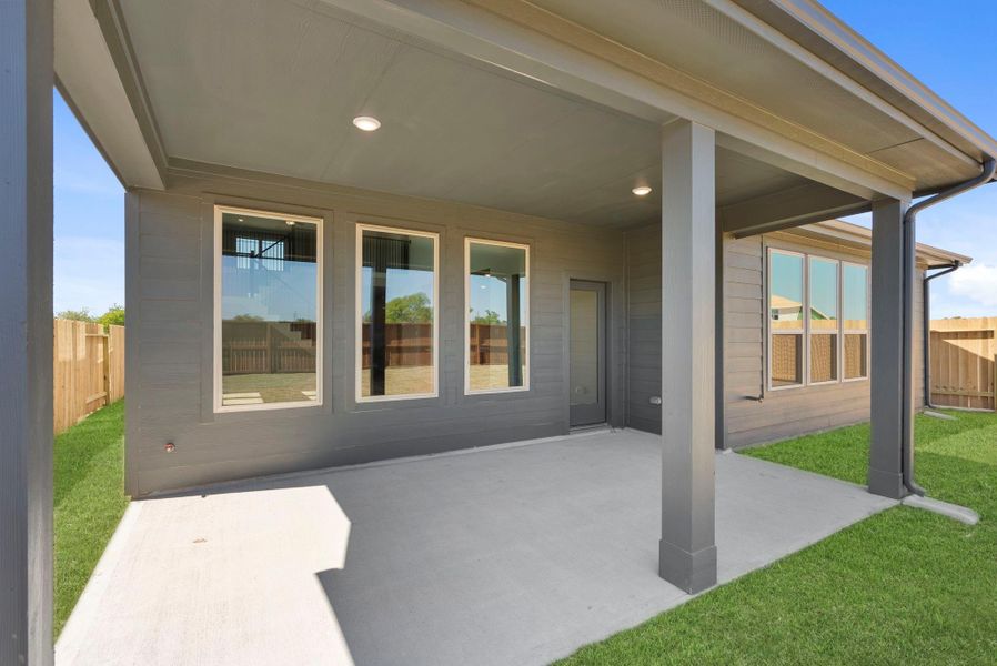 Exterior details and patio area of a home in Trinity Grove, Spring (Image 3).