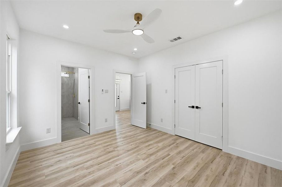 Primary bedroom with recessed lighting, a ceiling fan, a closet, and ensuite Primary bedroom with recessed lighting, a ceiling fan, a closet, and ensuite