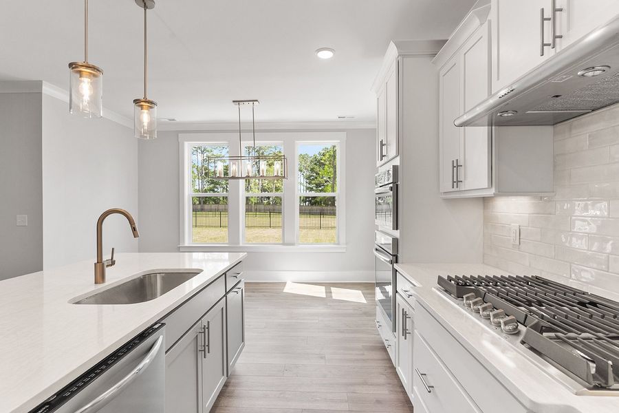 Representative furnished interior of a home built from the The Chandler by RobuckHomes in Windwater, Hampstead (Image 12).