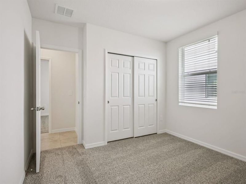 Spacious, unfurnished interior of a new home in Villamar - Signature Series, Winter Haven (Image 12).