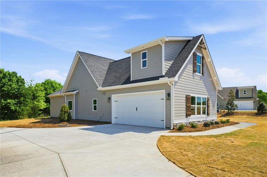 Front exterior of a new home in , Monroe, GA, highlighting curb appeal (Image 21).