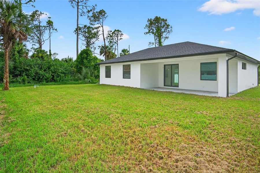Front exterior of a new home in , North Port, FL, highlighting curb appeal (Image 31). Front exterior of a new home in , North Port, FL, highlighting curb appeal (Image 31).