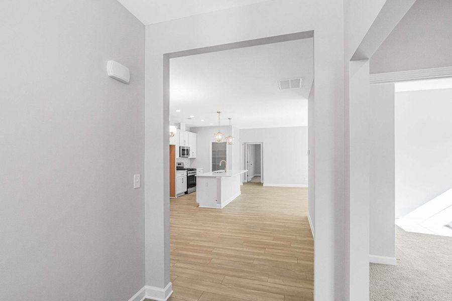 Representative unfurnished interior of a home built from the Weymouth by Caviness & Cates Communities in Bartlett Manor, Youngsville (Image 94).
