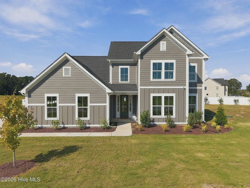 Front exterior of a new home in Dixon Grove, Grimesland, NC, highlighting curb appeal (Image 29).