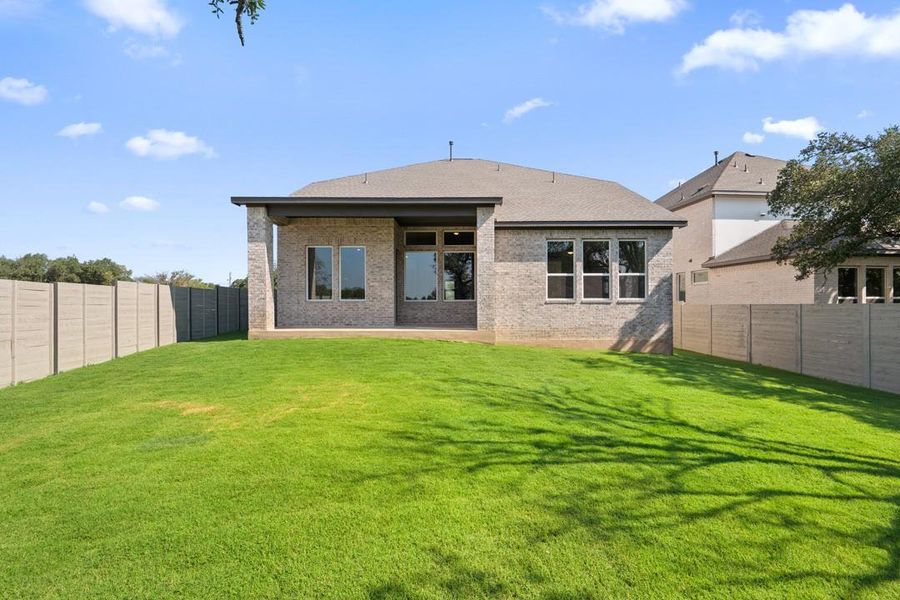 Front exterior of a new home in Park Collection At Wolf Ranch, Georgetown, TX, highlighting curb appeal (Image 23).