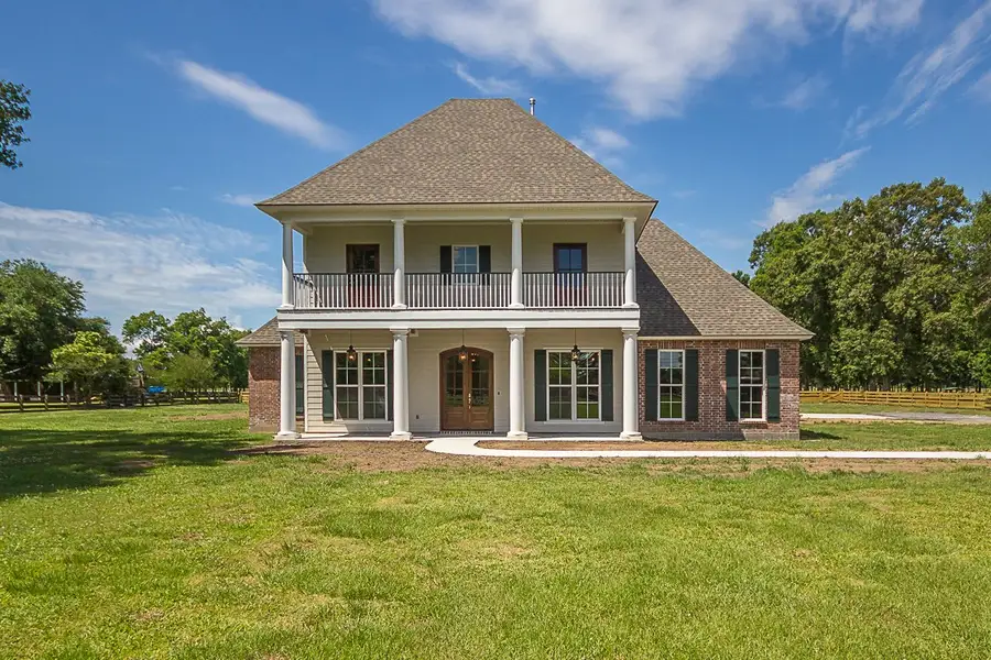 Representative exterior photo of a completed home built from the The Chateau French by Manuel Builders in Chapel Bend, Montgomery, TX (Image 12).