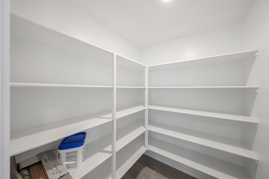 A white shelving unit. A white shelving unit.