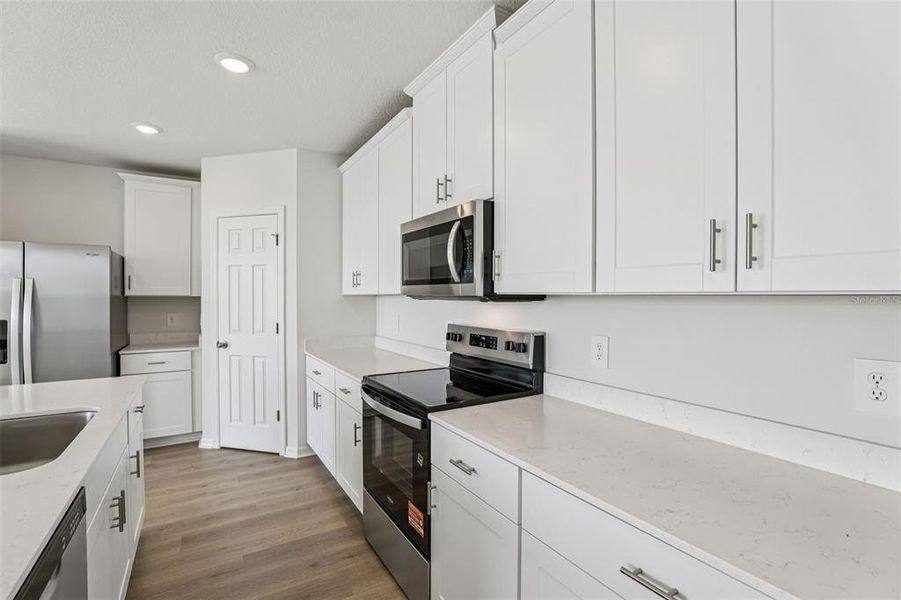Furnished interior view inside a new home in Lake Deer Estates - Signature Series, Poinciana (Image 13).
