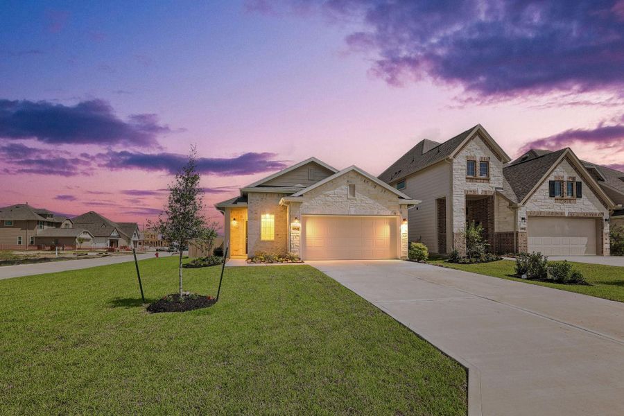 Front exterior of a new home in The Landing, New Caney, TX, highlighting curb appeal (Image 2). Front exterior of a new home in The Landing, New Caney, TX, highlighting curb appeal (Image 2).