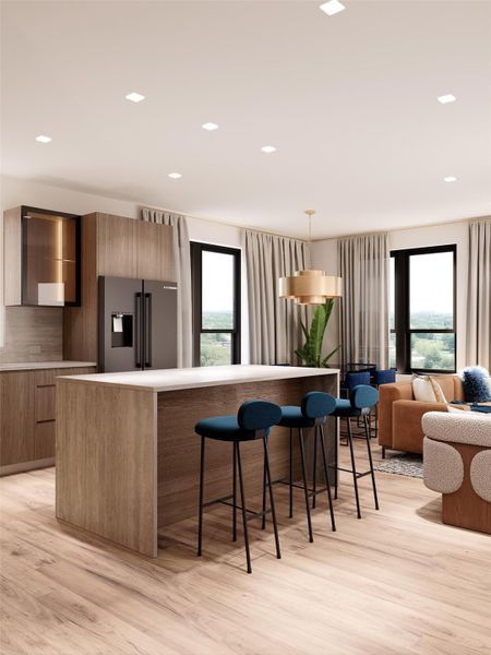 This open-concept kitchen and living area at The Ferguson features Bosch appliances, natural wood tones, and curated finish selections This open-concept kitchen and living area at The Ferguson features Bosch appliances, natural wood tones, and curated finish selections