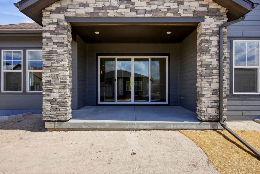 Exterior details and patio area of a home in Hilltop at Inspiration, Aurora (Image 3).