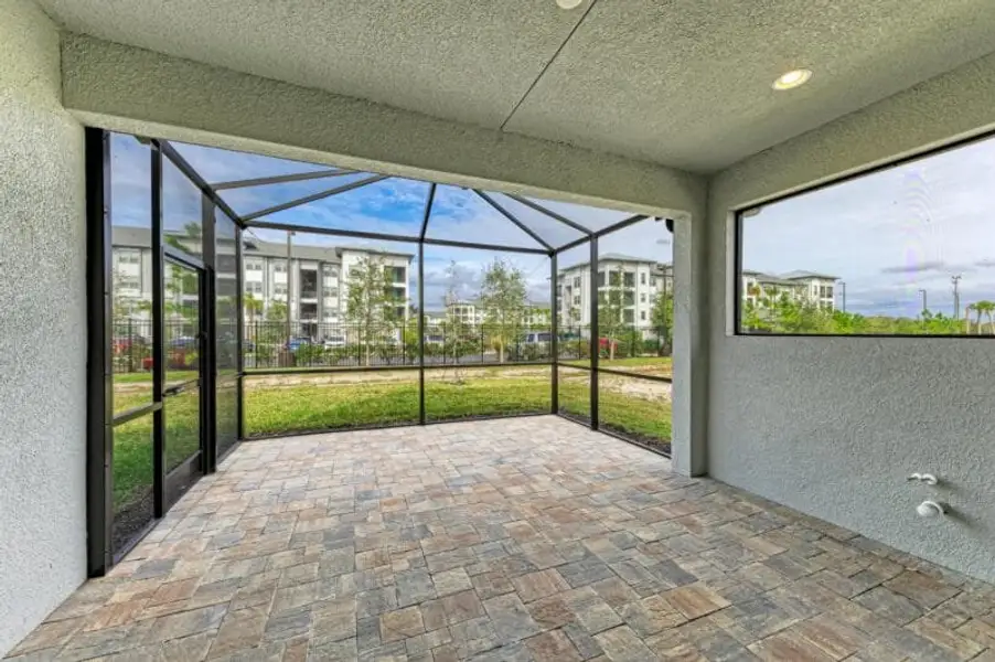 Exterior details and patio area of a home in Reflection Villas at Watercolor Place, Bradenton (Image 2).