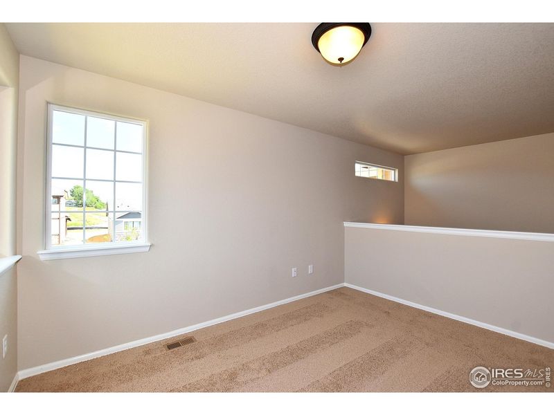 Spacious, unfurnished interior of a new home in Union Colony West, Greeley (Image 34).