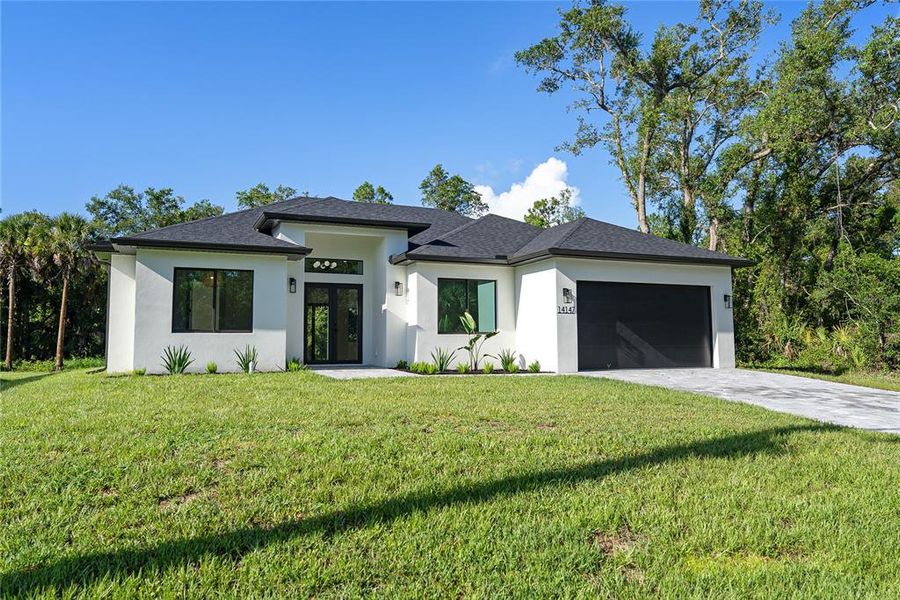 Front exterior of a new home in , Port Charlotte, FL, highlighting curb appeal (Image 33). Front exterior of a new home in , Port Charlotte, FL, highlighting curb appeal (Image 33).