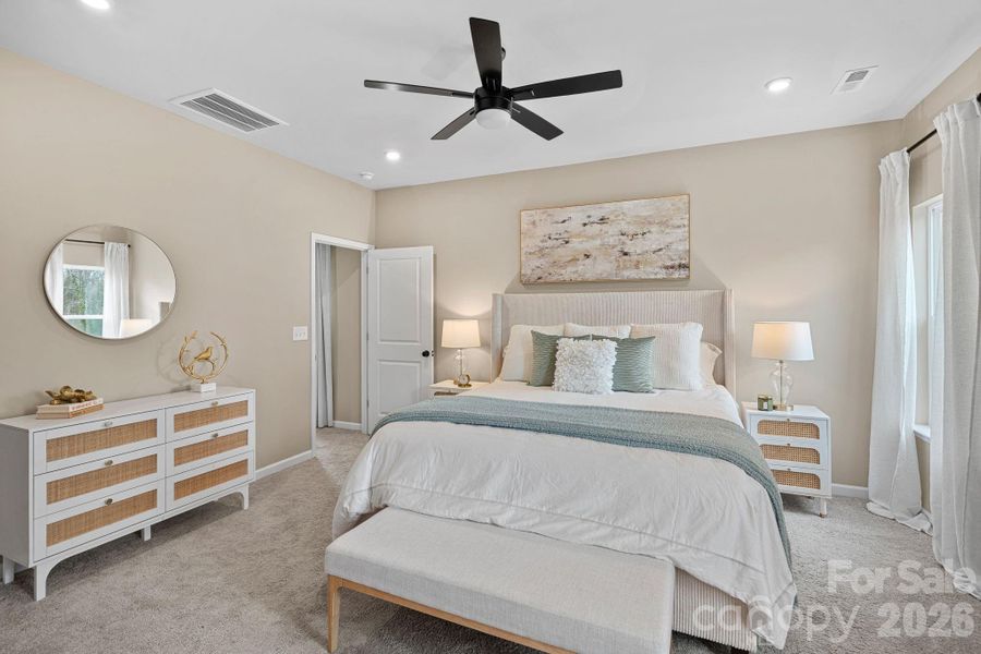 Primary suite boasts ceiling fan and recessed lighting. Primary suite boasts ceiling fan and recessed lighting.