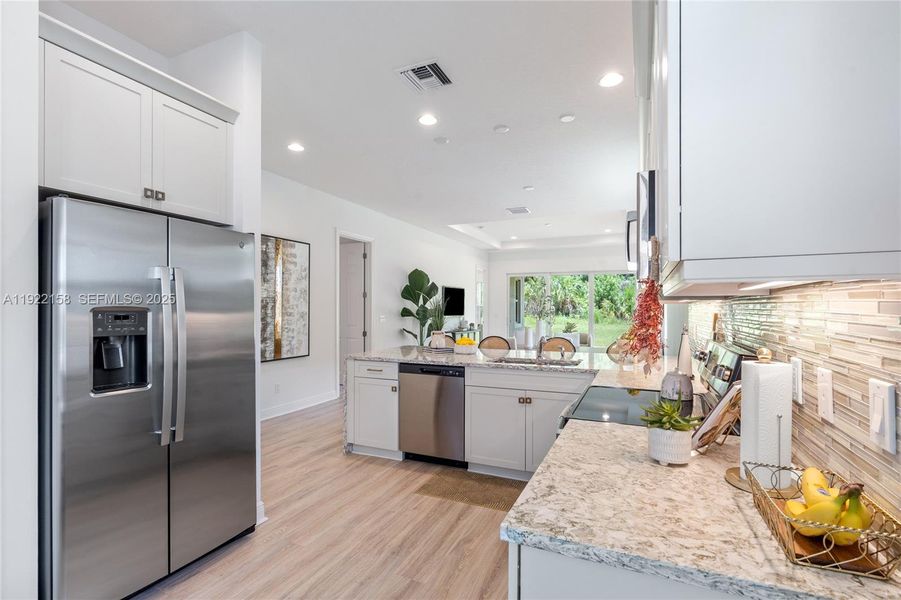 Furnished interior view inside a new home in PGA Village Verano, Port St. Lucie (Image 3).