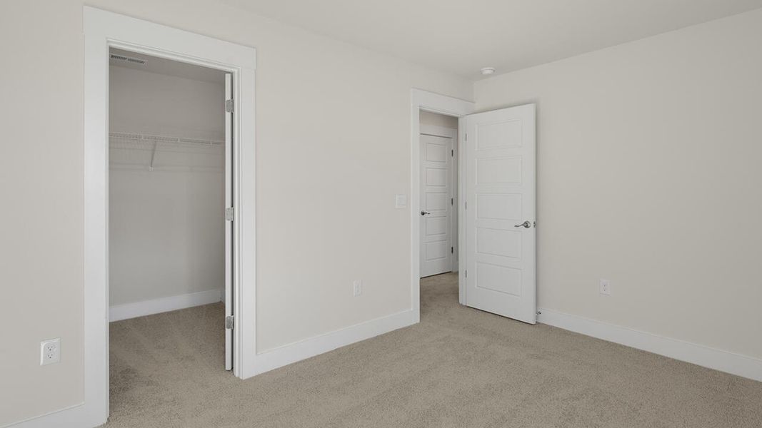 Spacious, unfurnished interior of a new home in Sidbury Station, Castle Hayne (Image 42).