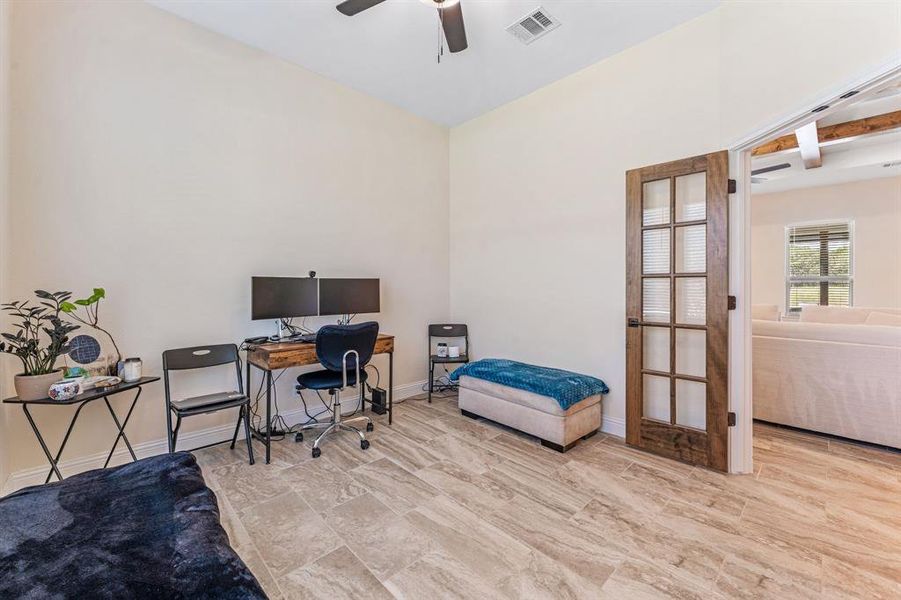 Office featuring a ceiling fan and wood tiled floors Office featuring a ceiling fan and wood tiled floors