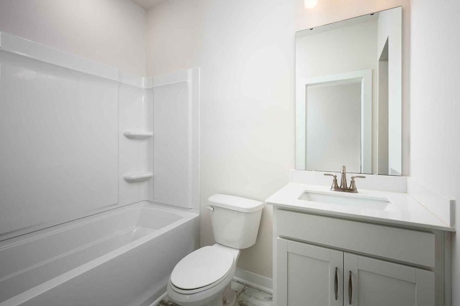 Representative furnished interior of a home built from the The Remely by David Weekley Homes in Central Living at Craig, Charlotte (Image 4).