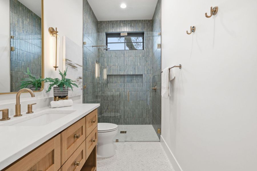 Full bathroom with vanity and a stall shower