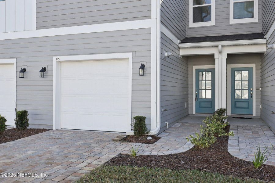 Exterior details and patio area of a home in Brandon Lakes at Silver Landing, St. Augustine (Image 24).