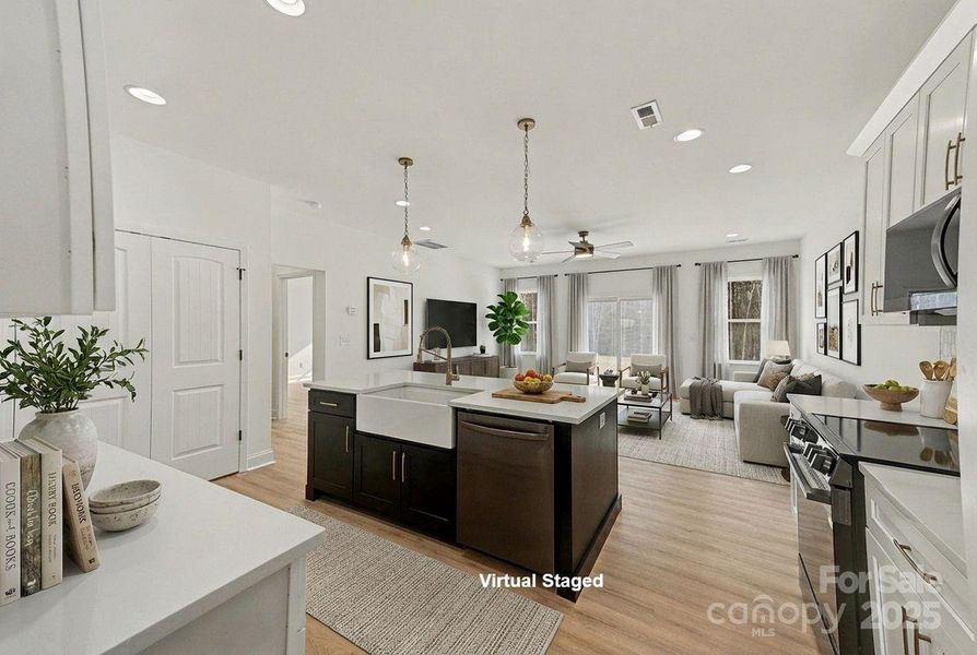 Open concept design features a kitchen that directly overlooks and connects to the family room, creating a spacious and inviting living area. Open concept design features a kitchen that directly overlooks and connects to the family room, creating a spacious and inviting living area.