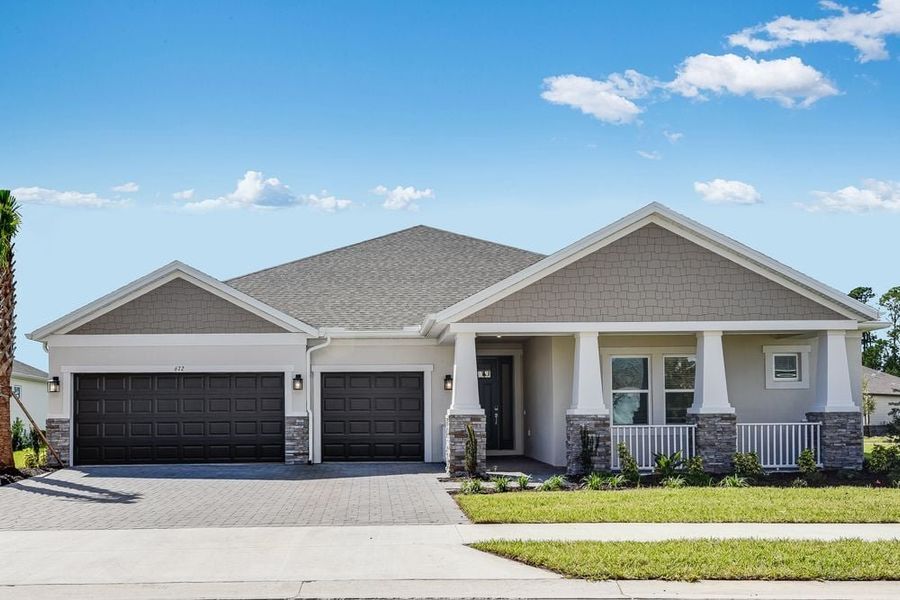 Representative exterior photo of a completed home built from the Sunset by Taylor Morrison in Ardisia Park, New Smyrna Beach, FL (Image 1).